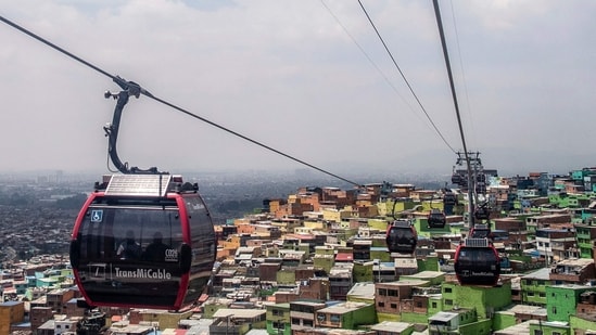 Ciudad Bolivar's transformation into a tourist destination with the introduction of the TransMiCable cable car has attracted about 400 tourists a month.(AFP)